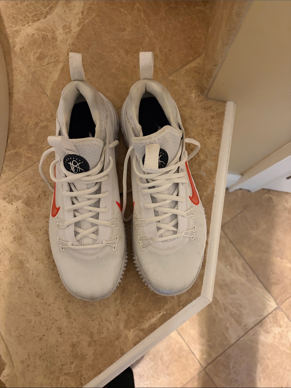 Nike Kids White Turf shoes with Orange Swoosh
